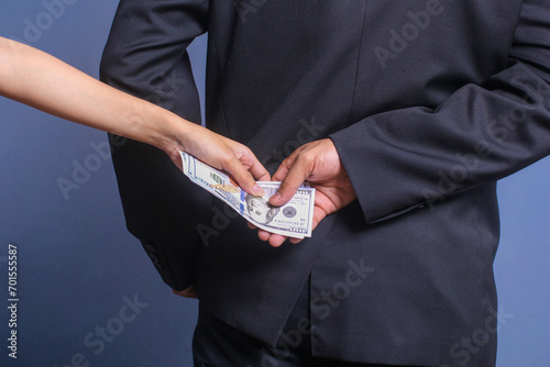 Man receiving bribe money from behind. Concept for corruption, bribery and crime