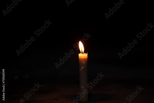 candles in the dark, flame of a candle burning in the dark
