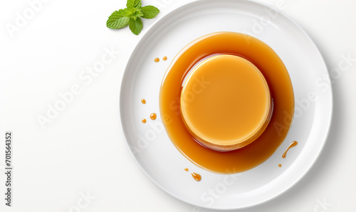 Flat lay of Crème caramel, Caramel custard pudding in the white plate. french dessert. Isolate on white background. copy space photo