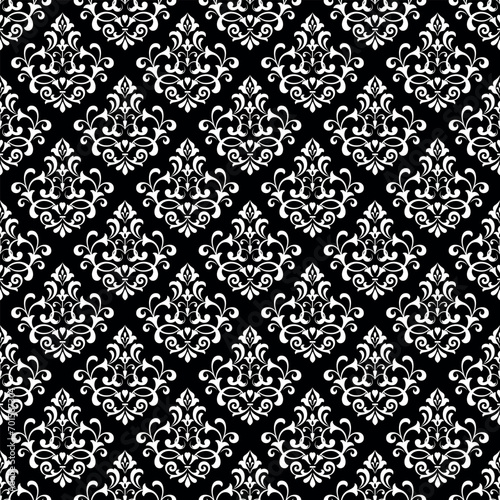 Wallpaper in the style of Baroque. Seamless vector background. White and black floral ornament. Graphic pattern for fabric, wallpaper, packaging. Ornate Damask flower ornament