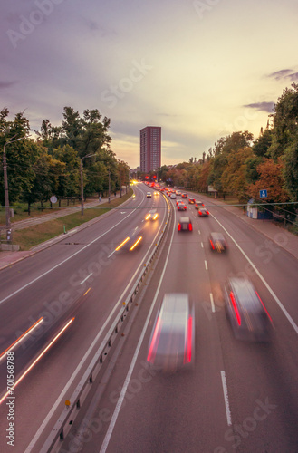 Traffic on highway, Kyiv, Ukraine. Traffic jam in evening city. Kyiv cityscape. Cars in motion, high angle view. Urban scene with transport. City street full of cars. Rush hour in the city.  © Nataliia