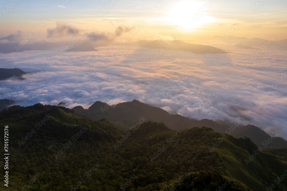 Obraz premium Top view Landscape of Morning Mist with Mountain Layer at north of Thailand. mountain ridge and clouds in rural jungle bush forest