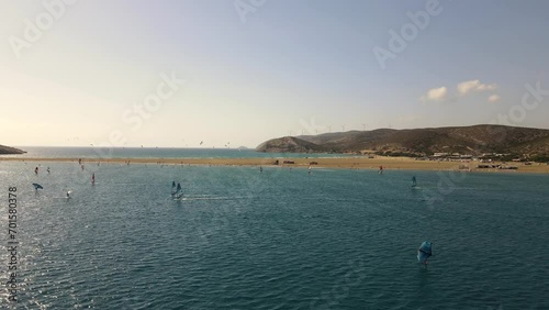 Drone shot of a large group of windsurfers and kitesurfers near the coast of Paralia Prasonisiou beach in Rhodes
