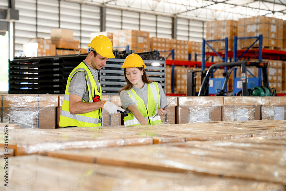 Warehouse worker and managers check stock and inventory by using digital tablet computer in the retail warehouse full of shelves with goods. Working in logistics and distribution center. Warehouse worker and managers check stock and inventory by using digital tablet computer in the retail warehouse full of shelves with goods. Working in logistics and distribution center.