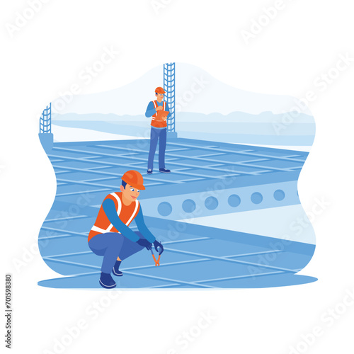 Construction engineers supervise and inspect building projects. Construction workers make steel reinforcement at the construction site. Construction site engineer concept. 