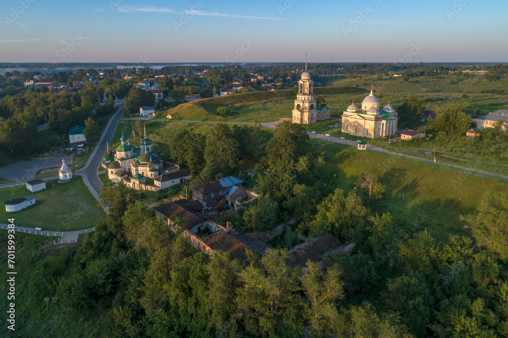 Ancient temples in the city landscape on a early July morning (aerial photography). Staritsa. Tver region, Russia