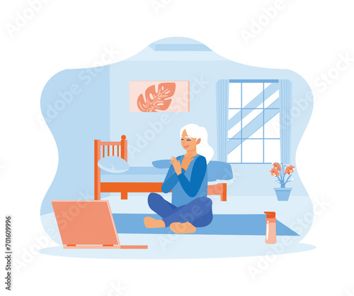 Happy middle aged woman sitting cross legged on the floor. Practice yoga while watching videos on a laptop. Happy, calm, peaceful girl concept. trend modern flat vector illustration