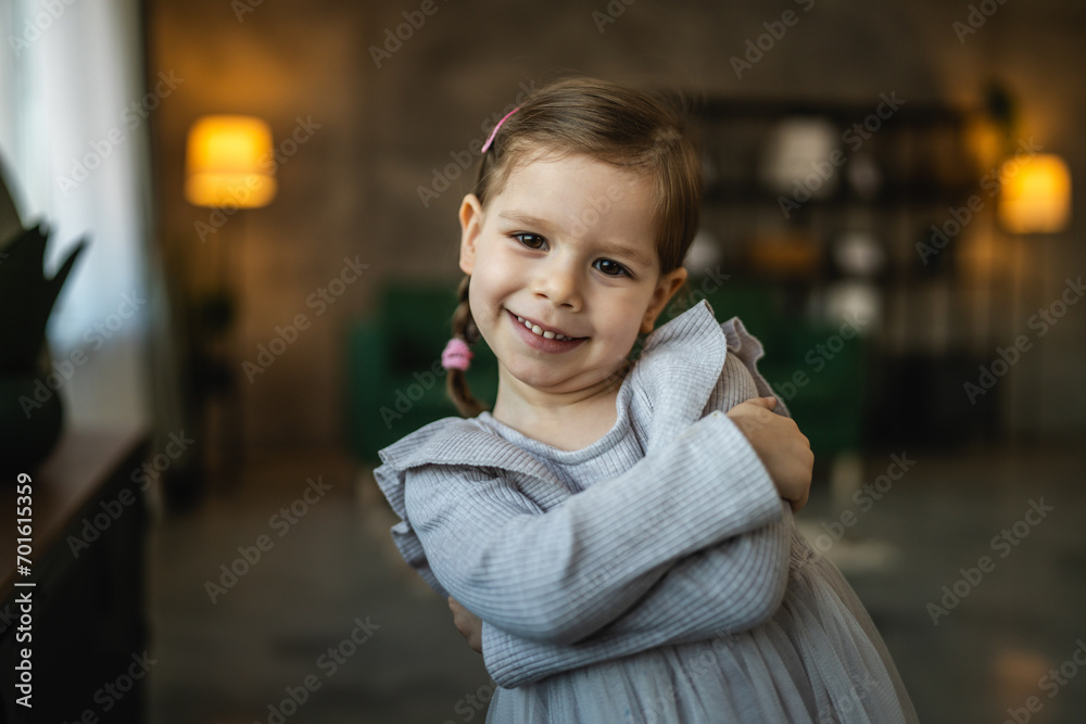 portrait of small caucasian girl two years old toddler at home