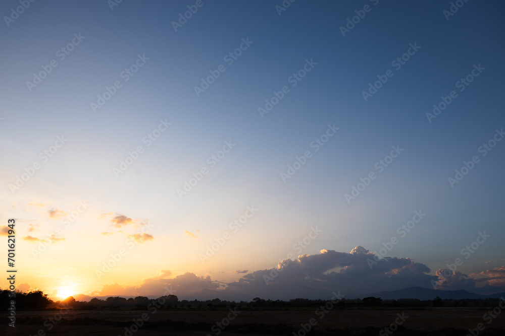 Beautiful sky and cloud at high. Landscape include space, light of nature, sunset, sunrise, horizon or skyline. Colorful with yellow, orange and blue at evening in autumn for background and wallpaper.