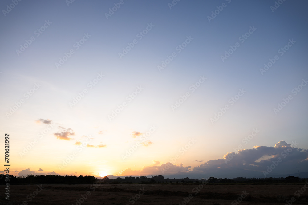 Beautiful sky and cloud at high. Landscape include space, light of nature, sunset, sunrise, horizon or skyline. Colorful with yellow, orange and blue at evening in autumn for background and wallpaper.