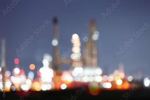 Abstract blur bokeh of oil gas refinery plant. May called petroleum, production or petrochemical plant. Industrial factory and engineering technology at night for business of power energy background. photo