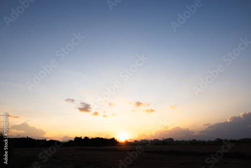 Beautiful sky and cloud at high. Landscape include space, light of nature, sunset, sunrise, horizon or skyline. Colorful with yellow, orange and blue at evening in autumn for background and wallpaper.