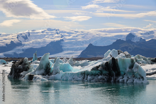 Iceland iceberg in Jökulsárlón glacier lagoon with Vatnajökull National Park in the background photo