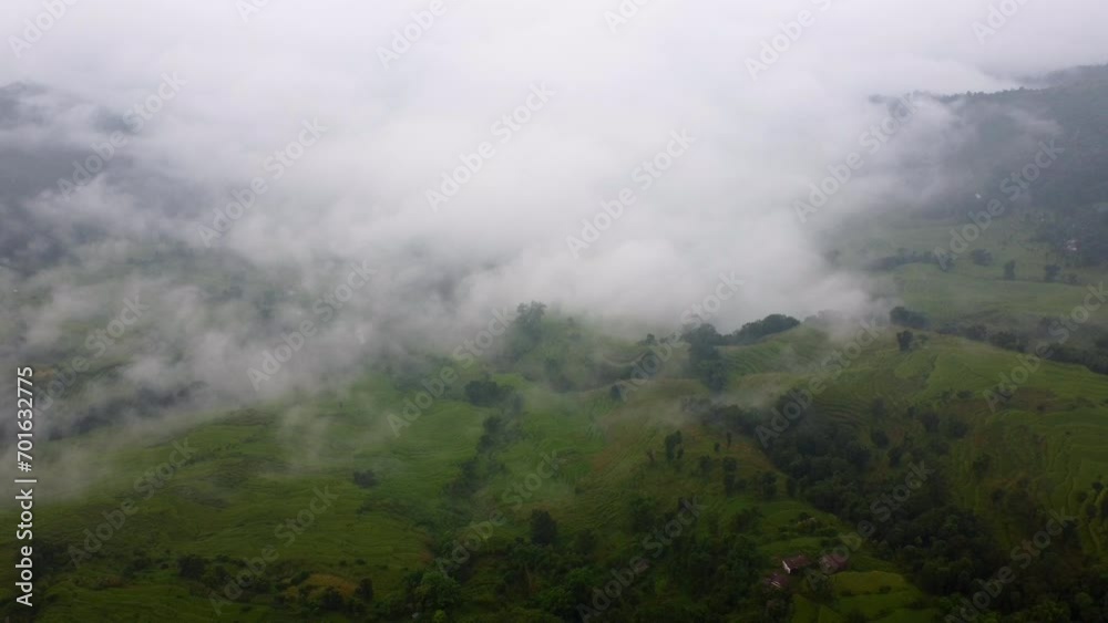 Misty Clouds Over Green Valleys In Nepal, South Asia. Aerial Drone Shot Misty Clouds Over Green Valleys In Nepal, South Asia. Aerial Drone Shot