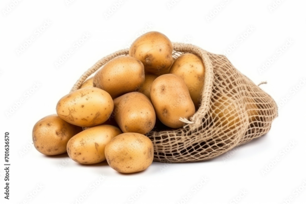 Mesh sack with isolated potatoes on white background Mesh sack with isolated potatoes on white background