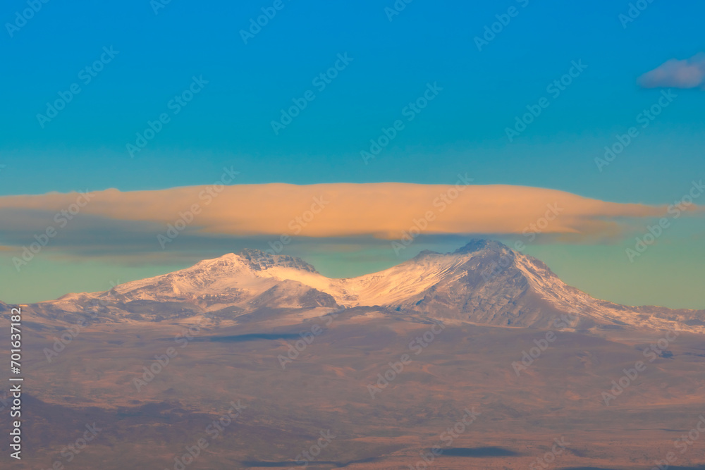 A saucer-shaped cloud over the two peaks of Mount Aragats, Armenia