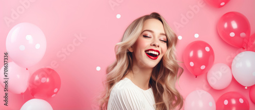 Cheerful beauty girl with red and pink balloon laughing on pink background, Valentines concept