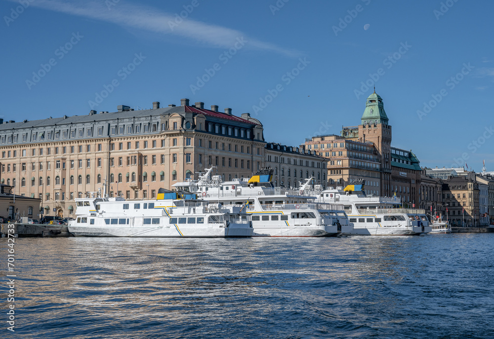 Sweden Stockholm view of Norrmalm district with Taxi and Tour Boats on a sunny day