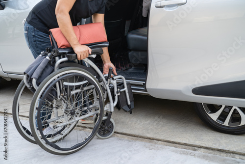 Asian disability woman on wheelchair getting in her car, Accessibility concept. © amazing studio