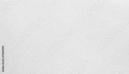 A refined, white paper texture with subtle patterns, ideal for backgrounds or elegant designs. photo