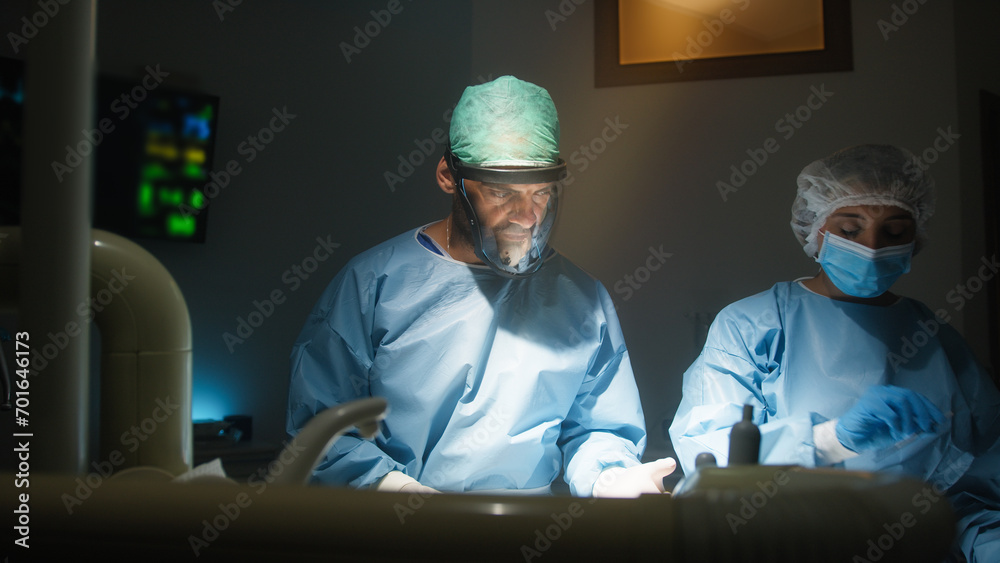Doctor and assistant works in operating room Doctor and assistant works in operating room