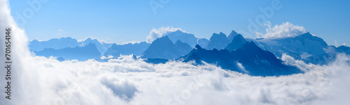 Austria, Tyrol, Panoramic view from Hoher Riffler towards Grosser Loffler and Schwarzenstein with thick fog in middle photo