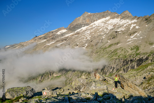 Austria, Tyrol, Female hiker following trail towards Hoher Riffler photo