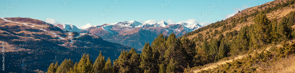 Mountain landscape in autumn. View of mountain slopes on a sunny day, Pyrenees, Andorra, Europe. Horizontal banner