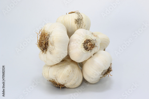 a bunch of garlic on a white background