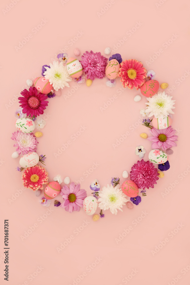 Easter wreath with decorated eggs and mini eggs on pink background. Decorative flower garland for traditional seasonal nature floral edible food design. Easter wreath with decorated eggs and mini eggs on pink background. Decorative flower garland for traditional seasonal nature floral edible food design.