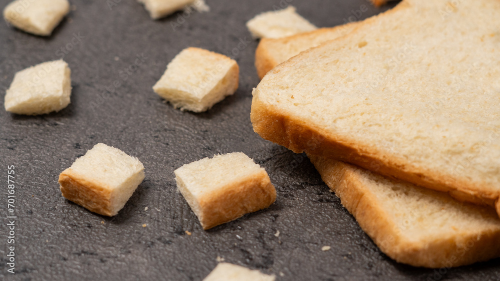Sliced bread isolated on gray background. bread cut into small squares