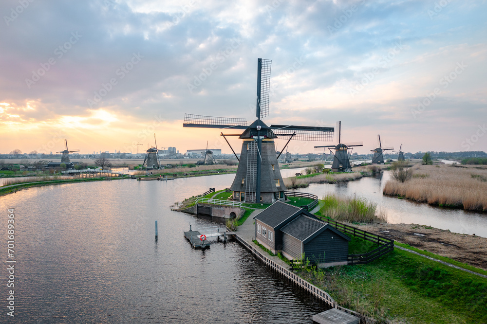 dutch windmill in the country at river at kinderdijk