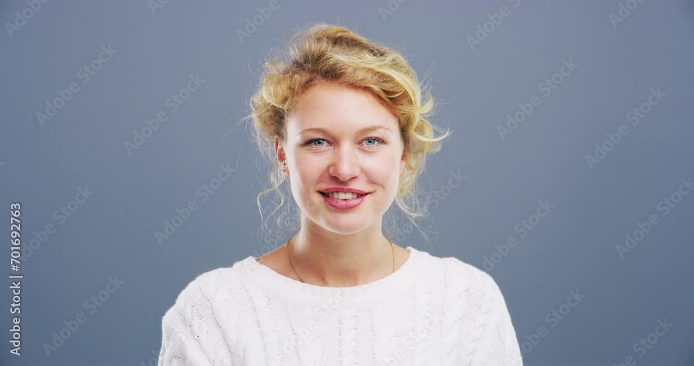 Woman, face and blowing kiss in studio for flirting, thank you or care gesture on gray background with mock up. Person, portrait and kissing emoji, expression or love for romance, gratitude and hands