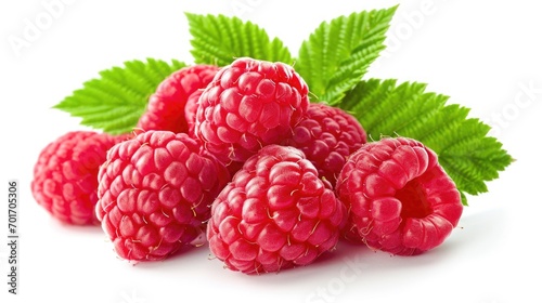 A bunch of raspberries with leaves placed on a white surface. Perfect for food and healthy eating concepts