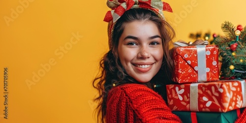 A woman in a red sweater holding a pile of presents. Perfect for holiday season and gift-giving occasions