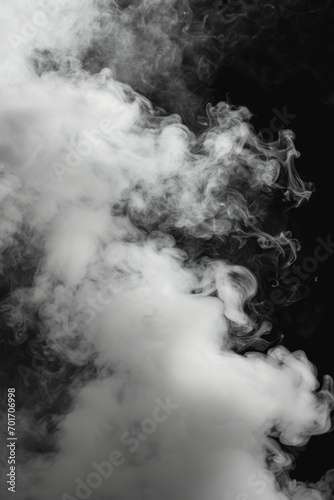 A captivating black and white photograph capturing smoke billowing out of a pipe. This versatile image can be used to add an atmospheric touch to various creative projects