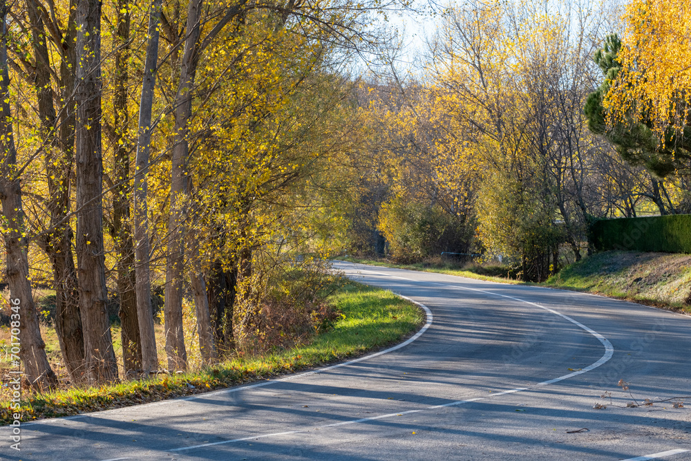 Curve in a road between fields in autumn Curve in a road between fields in autumn