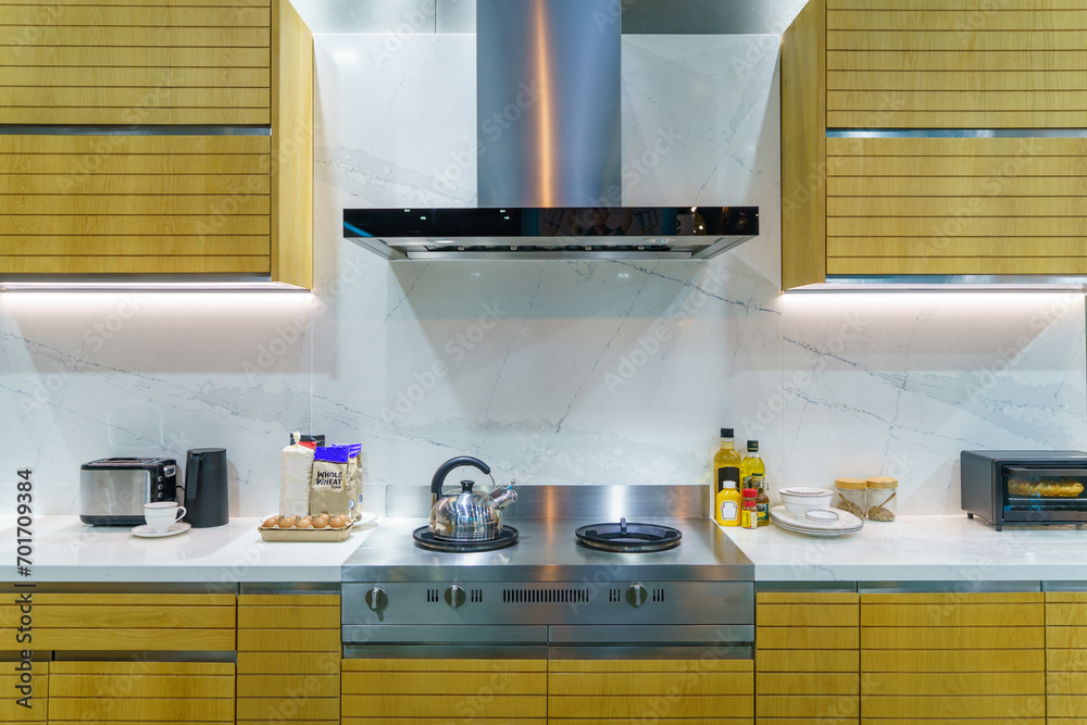 Interior of a modern kitchen with stove, oven and hood. Stock Photo ...