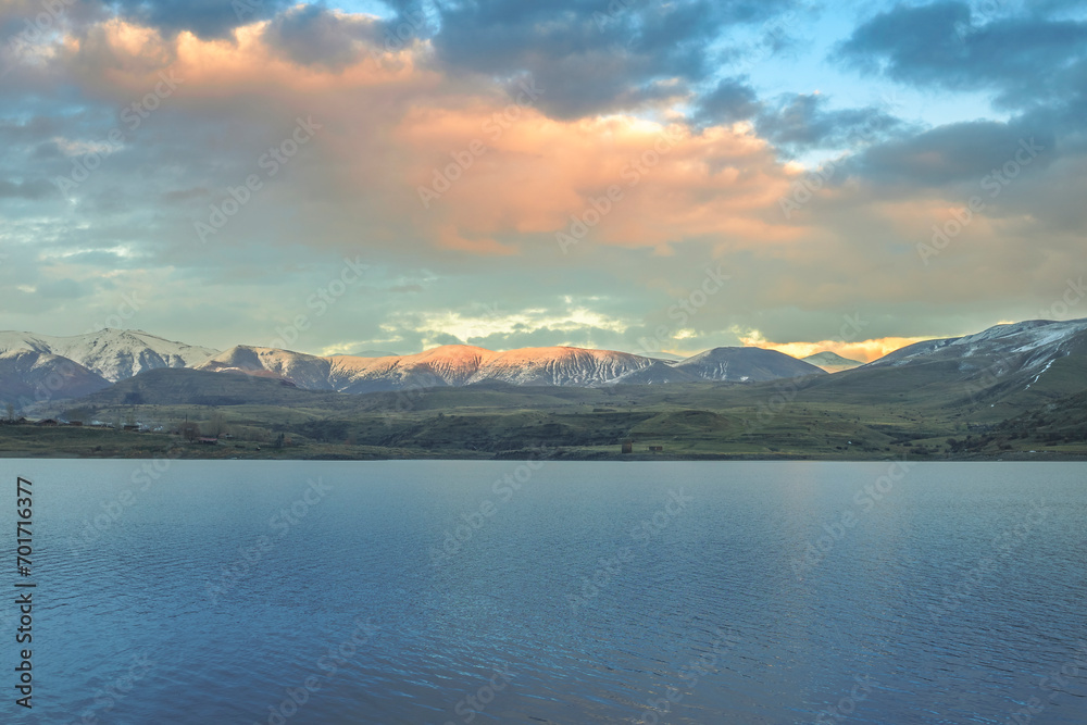 Sunset clouds over Kechut Reservoir. Travel destination Armenia