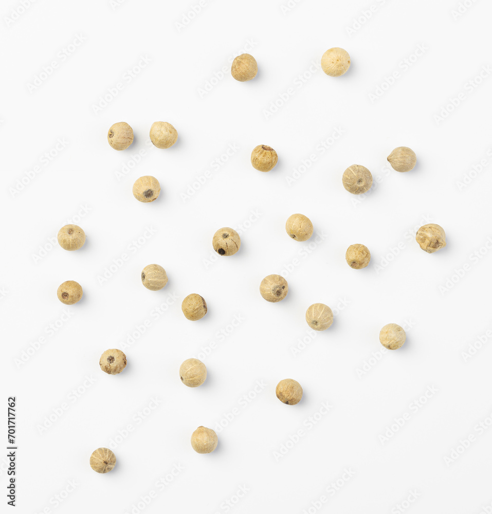 White peppercorn seeds isolated on a white background. White peppercorn seeds isolated on a white background.