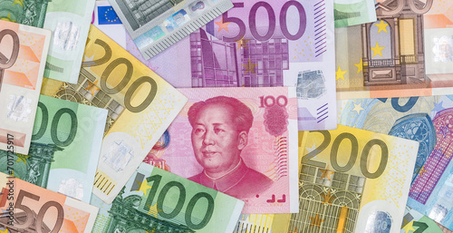 different euro and yuan bills as background.