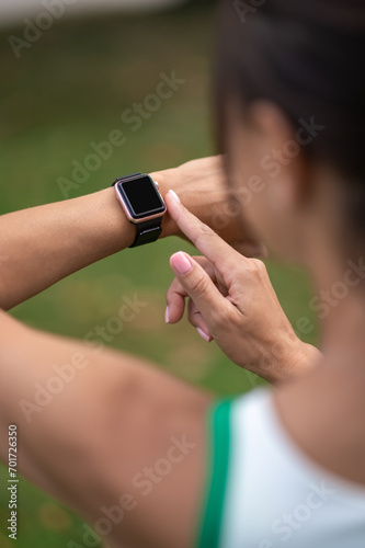 Close up of woman looking at her smartwatch