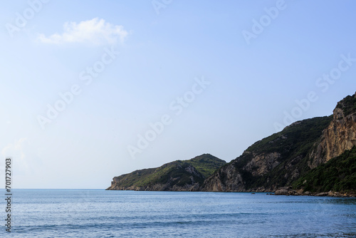 Sandy beach by the sea near Agios Georgios on the island of Corfu under a blue sky © were