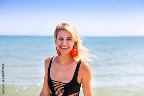 Woman in black swimwear on the summer beach