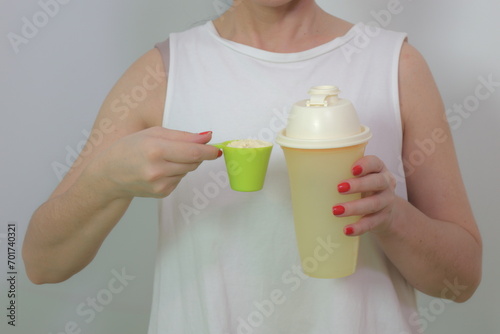 Woman prepares a protein shake