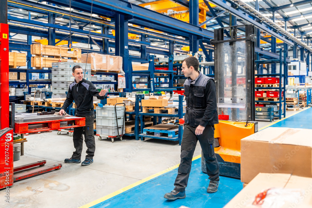Warehouse and handling workers in a logistic factory Warehouse and handling workers in a logistic factory
