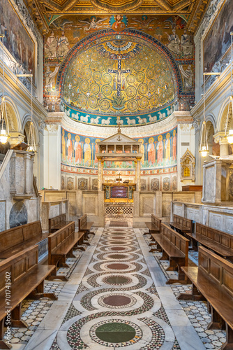 View of nave and altar inside historic Basilica in Italy