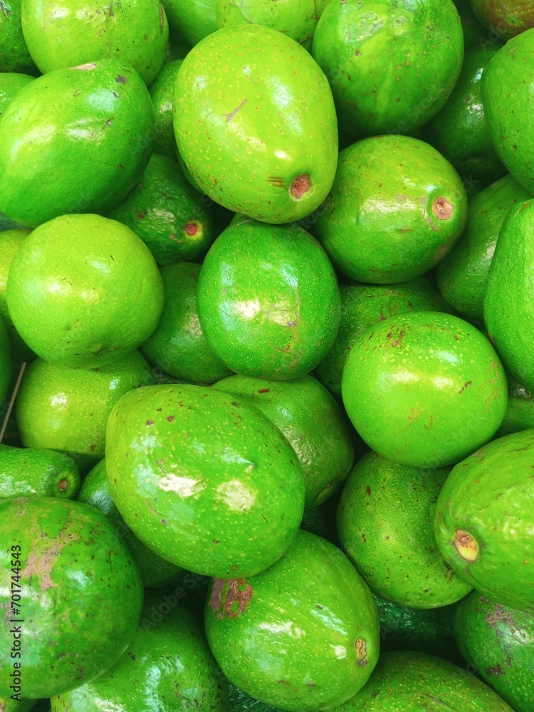 avocados stacked on top of each other avocados stacked on top of each other