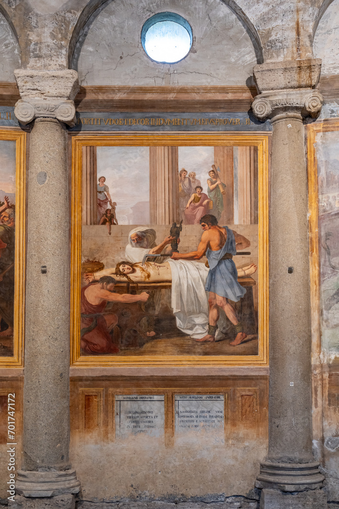 Detail of old painting exhibited between two ancient roman columns inside historic Basilica in Rome Detail of old painting exhibited between two ancient roman columns inside historic Basilica in Rome