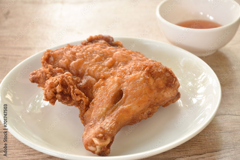 crispy fried chicken tight and leg on plate dipping sweet chili sauce cup crispy fried chicken tight and leg on plate dipping sweet chili sauce cup
